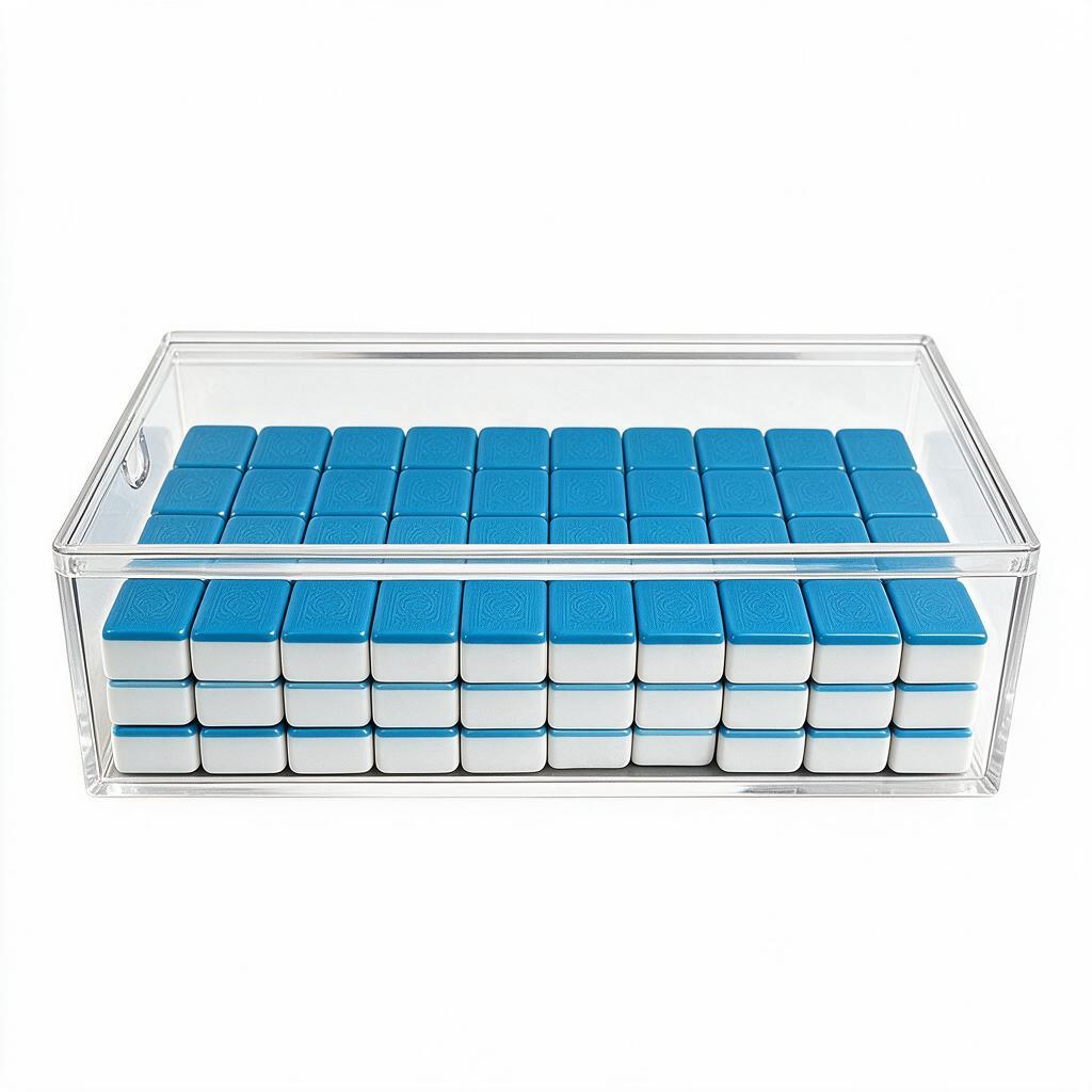 clear acrylic mahjong tile storage box with sliding lid for organizing, protecting, and displaying American mahjong tiles.