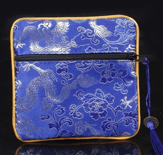 Mahjong dice and coin bag for organizing and protecting dice, betting coins, and other American mahjong accessories.