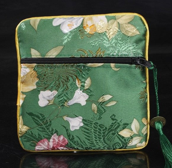 Mahjong dice and coin bag for organizing and protecting dice, betting coins, and other American mahjong accessories.