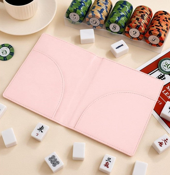 Premium leather NMJL playing card portfolio in soft pink, designed to protect the Official National Mah Jongg League playing card with slim pockets for secure storage. Perfect for American Mahjong players, league games, tournaments, and travel.