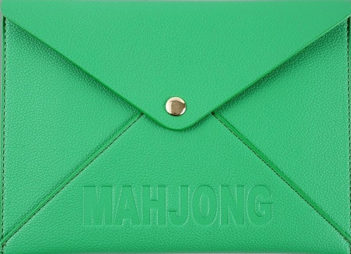 Premium leather NMJL playing card clutch with a secure snap closure, designed to protect the Official National Mah Jongg League playing card. Available in navy, emerald green, blush pink, and bright pink for stylish storage, travel, league play, and game nights.