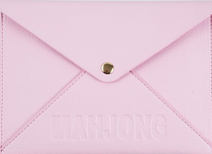 Premium leather NMJL playing card clutch with a secure snap closure, designed to protect the Official National Mah Jongg League playing card. Available in navy, emerald green, blush pink, and bright pink for stylish storage, travel, league play, and game nights.