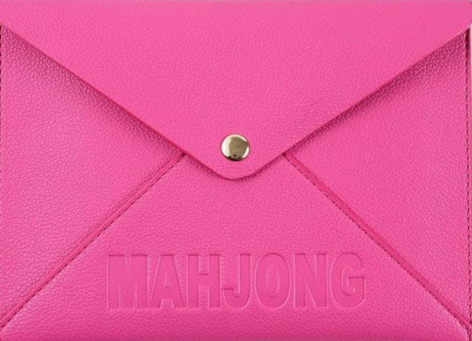 Premium leather NMJL playing card clutch with a secure snap closure, designed to protect the Official National Mah Jongg League playing card. Available in navy, emerald green, blush pink, and bright pink for stylish storage, travel, league play, and game nights.